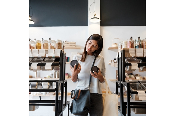 Image Woman reading a label